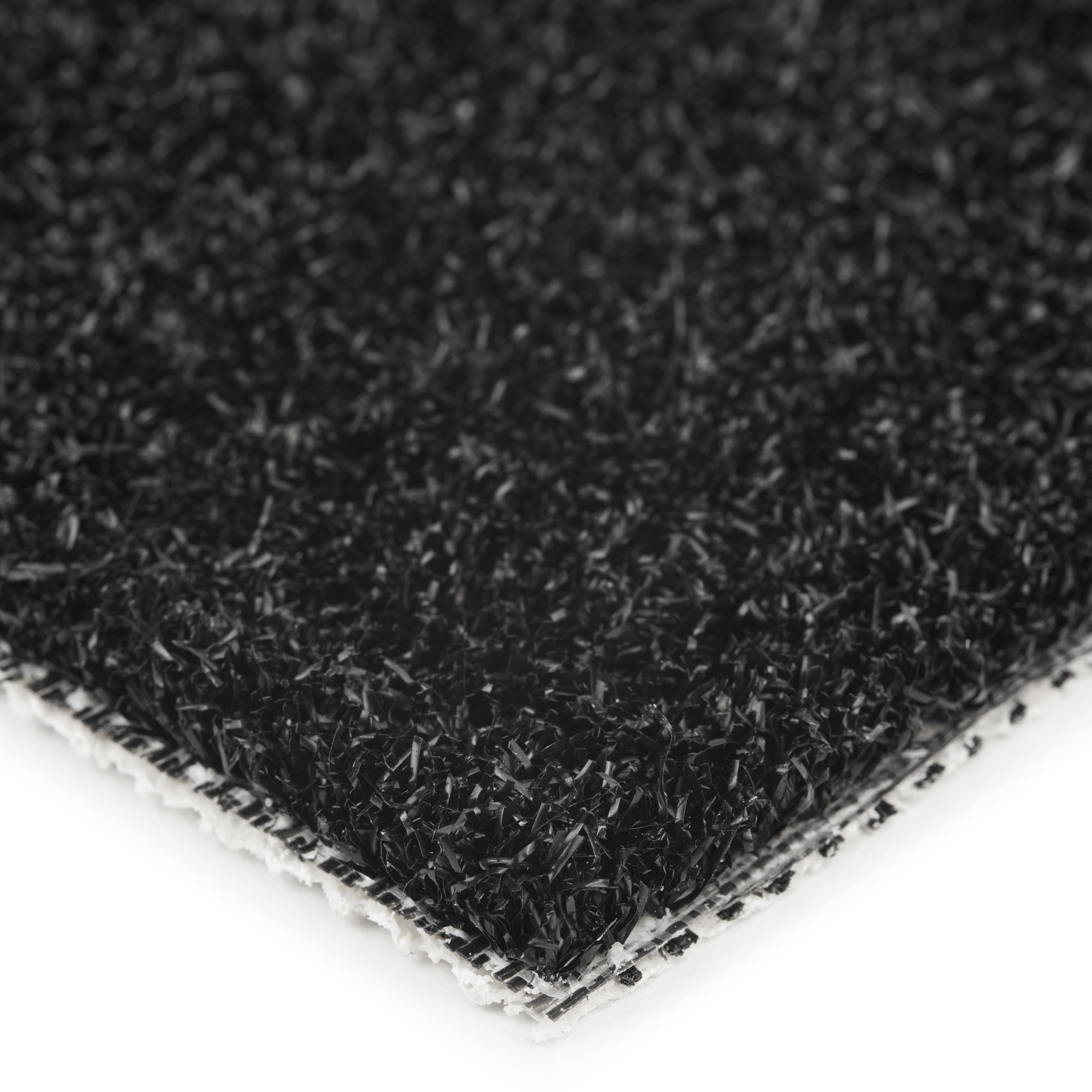 Close-up of a black synthetic turf mat with textured surface for outdoor use.